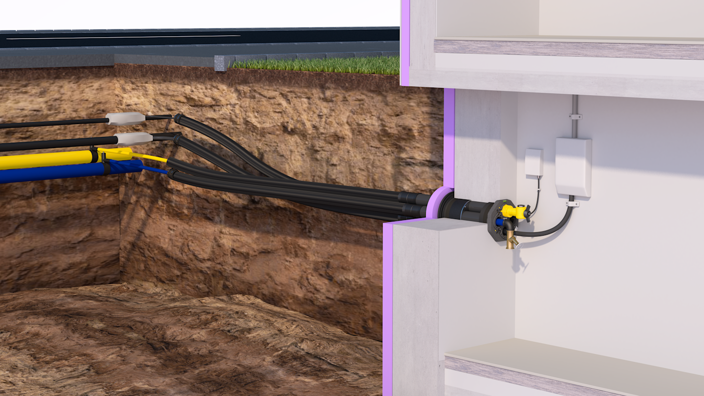 Erdwärme-Installation: Rohre im Boden führen zu einem Haus.