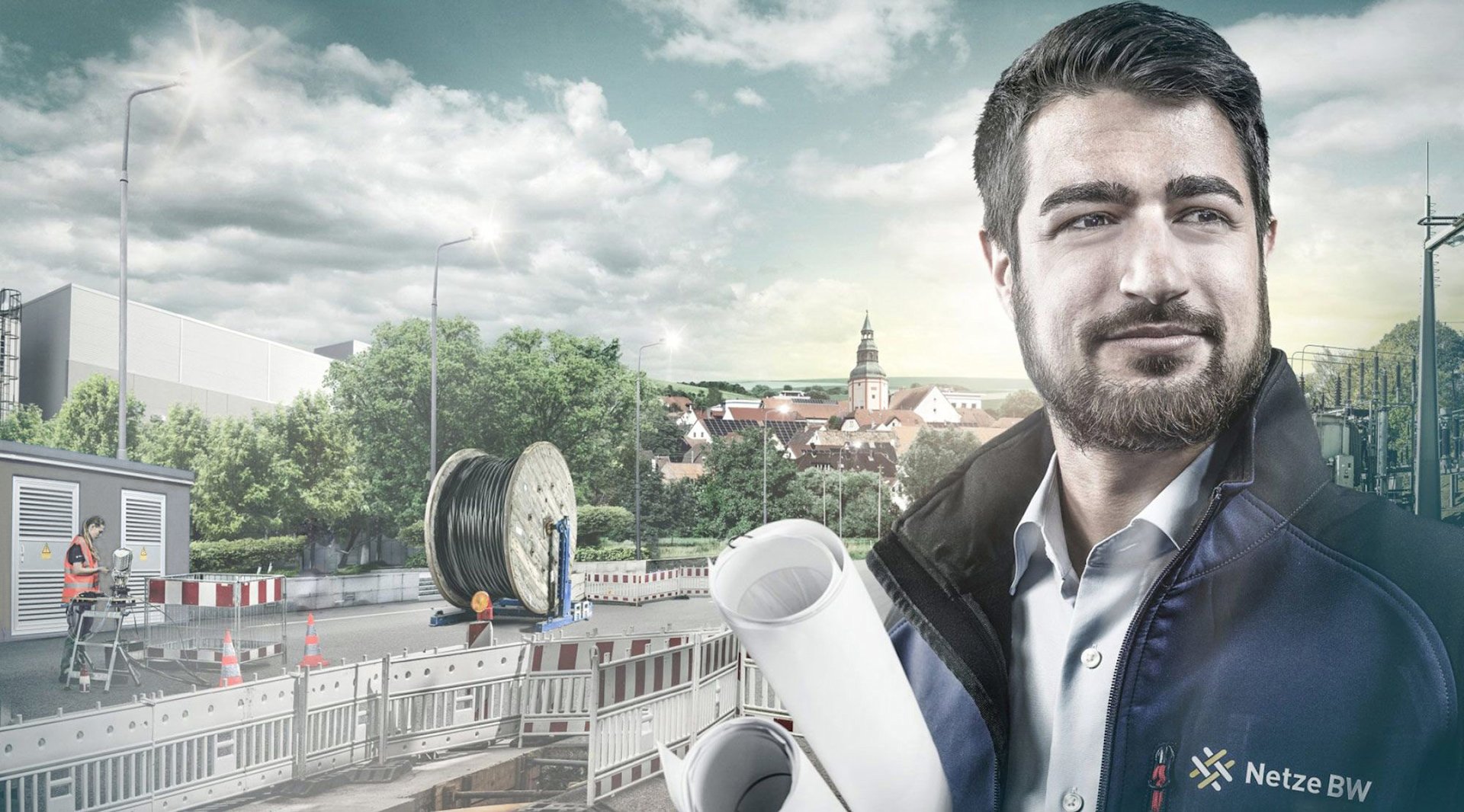 Netze BW-Ingenieur mit Plänen vor Bauprojekt.